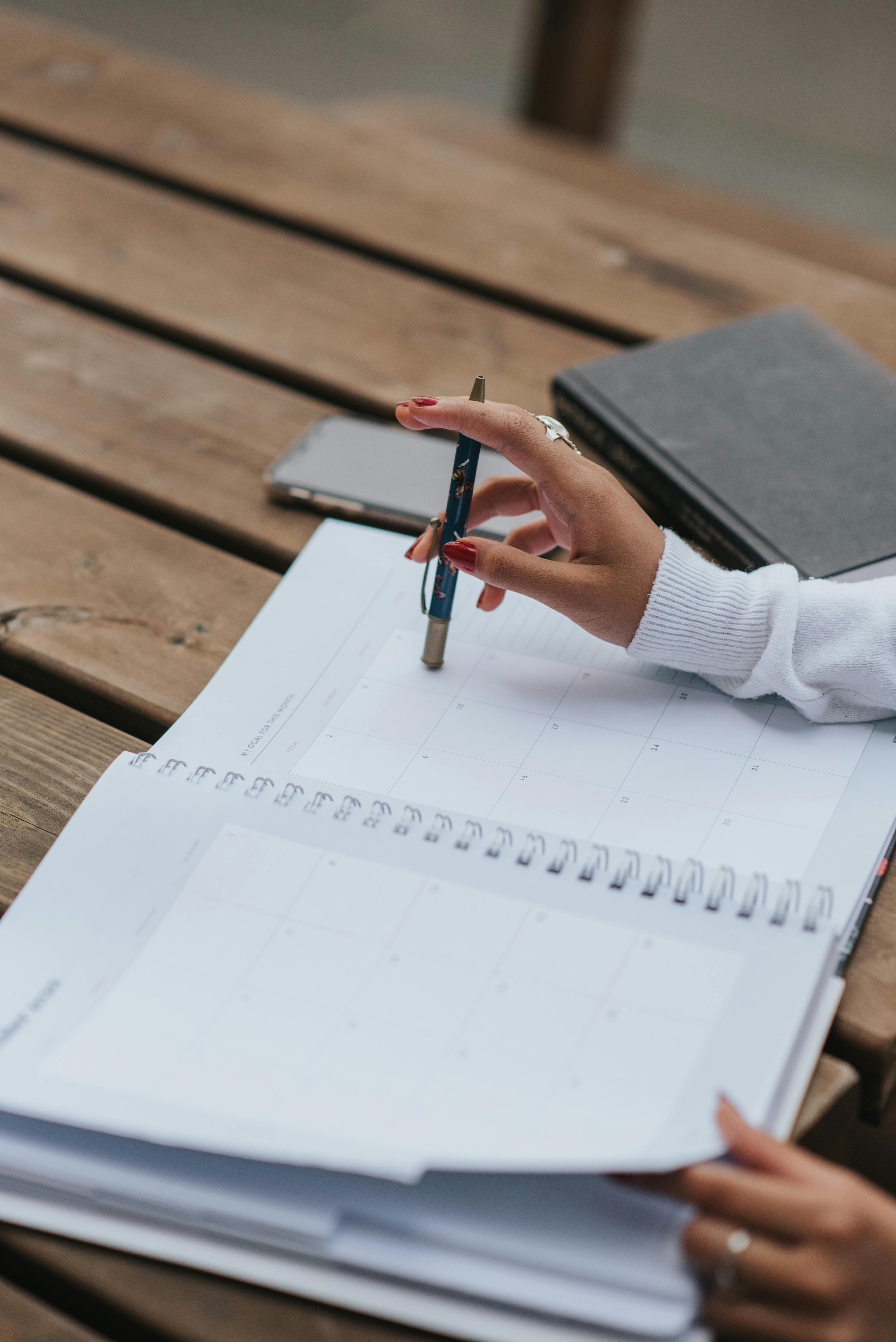 A person writing on a piece of paper. The image conveys focus and productive learning.